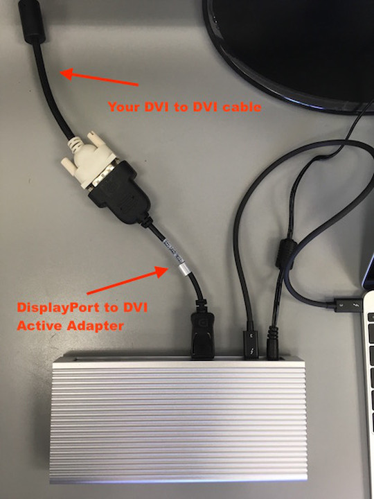 A close-up of the Active DisplayPort to DVI adapter connecting the USB-C Dock and monitor.