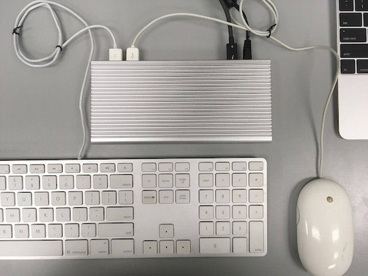 Apple Keyboard and Apple Mouse connected to the USB Type-A ports on the USB-C Dock.